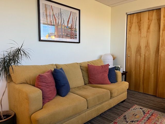 Another photo of our office showing a comfortable couch